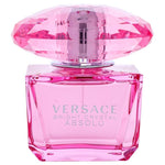 Pink Versace perfume bottle with diamond-shaped cap on a white background