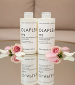 Olaplex No.4 Shampoo and No.5 Conditioner bottles on a light background
