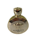 Gold Versace perfume bottle on a white background