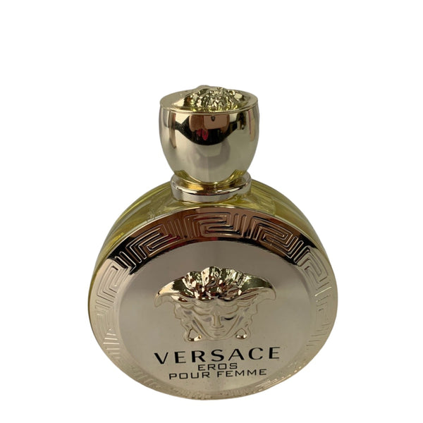 Gold Versace perfume bottle on a white background
