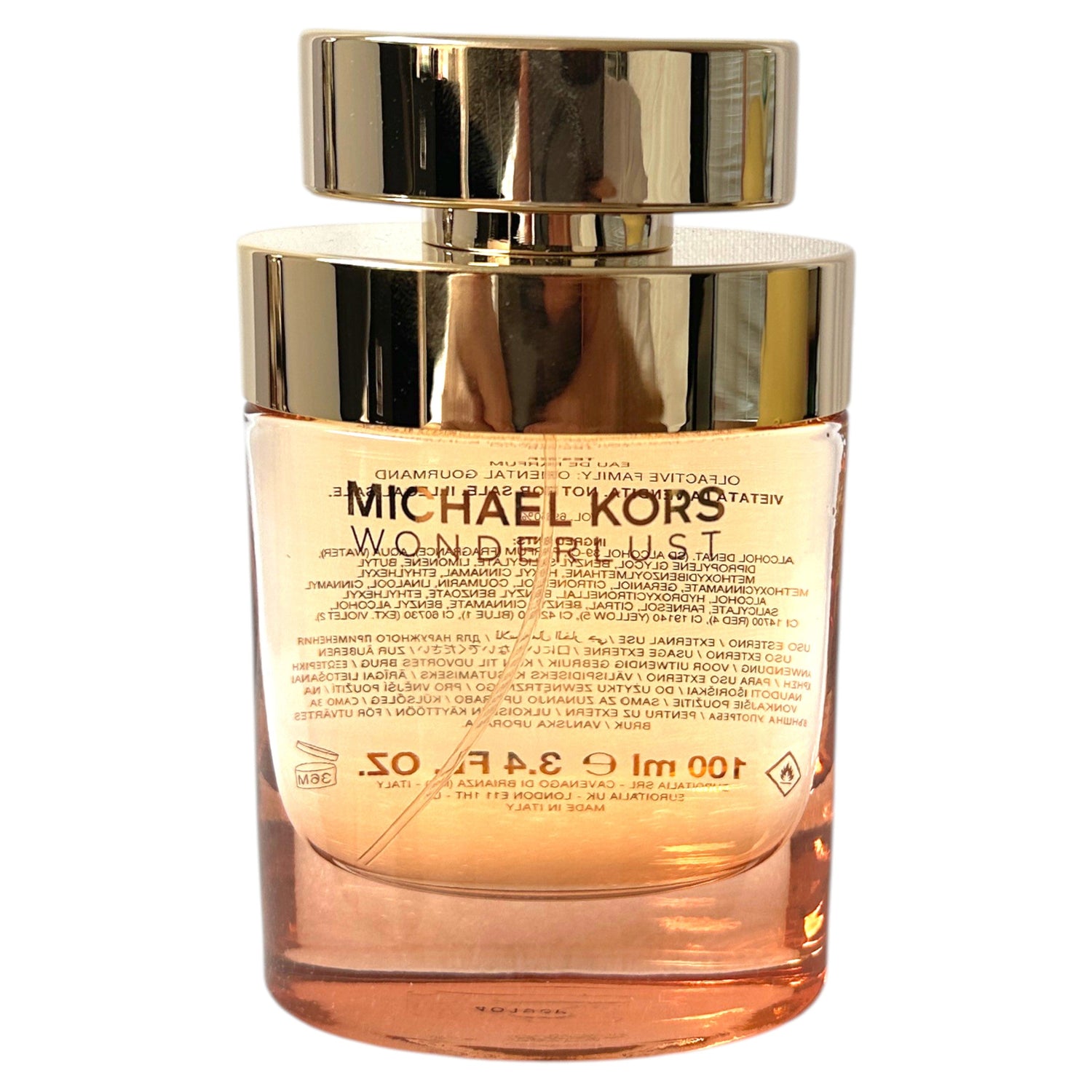 Michael Kors Wonderlust perfume bottle on a white background