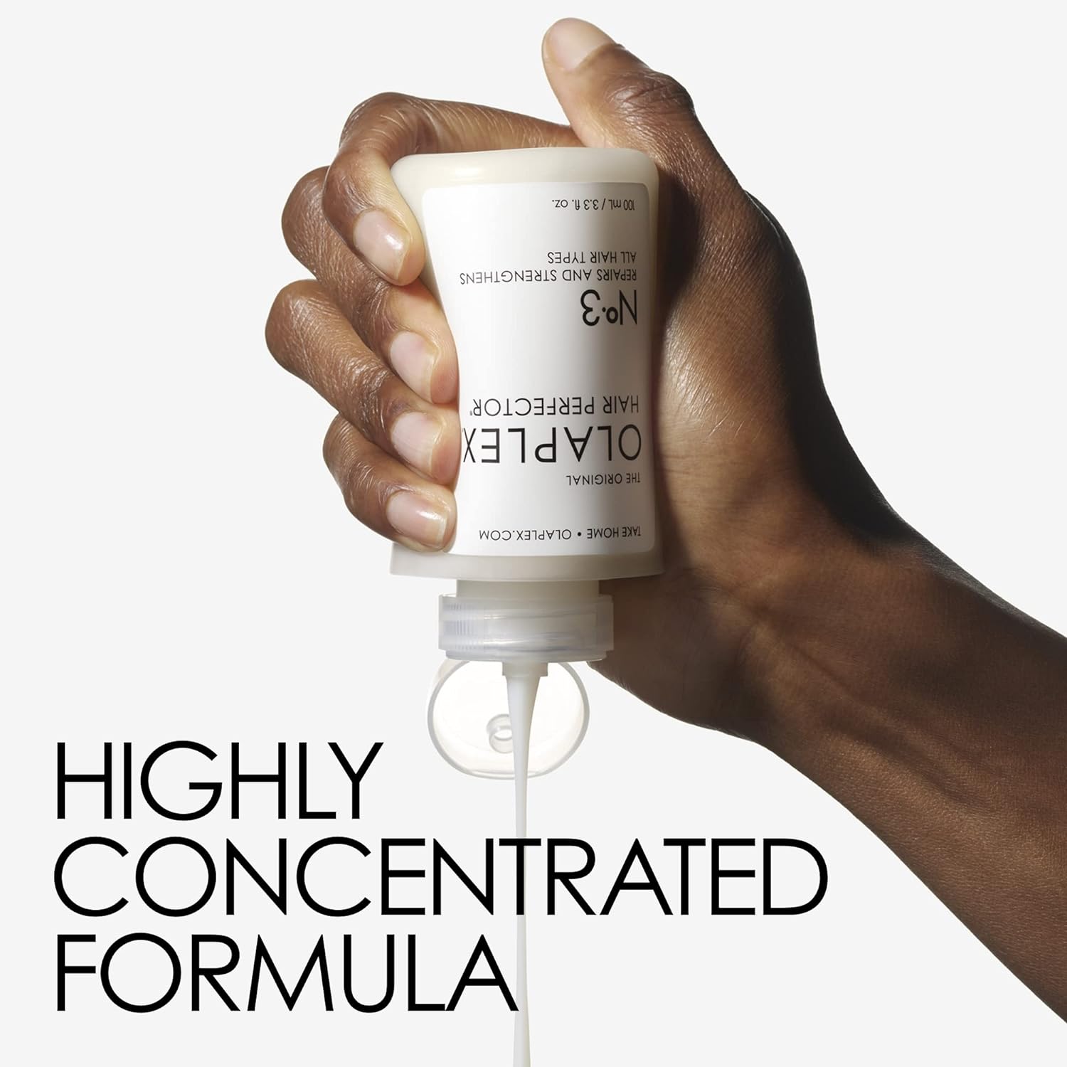Hand holding a bottle of Olaplex hair product with text 'Highly Concentrated Formula'.