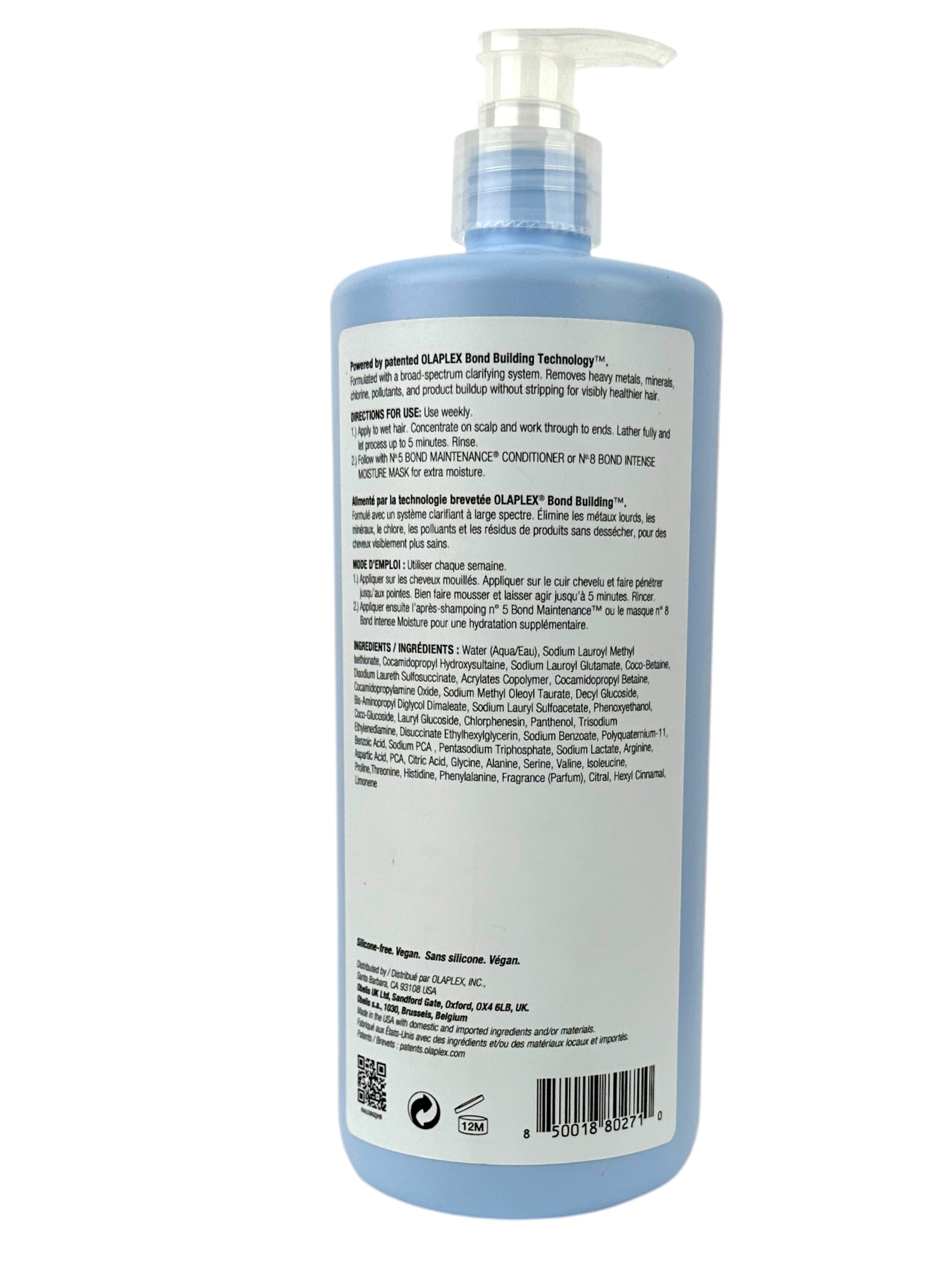 Blue bottle with pump and label on a white background