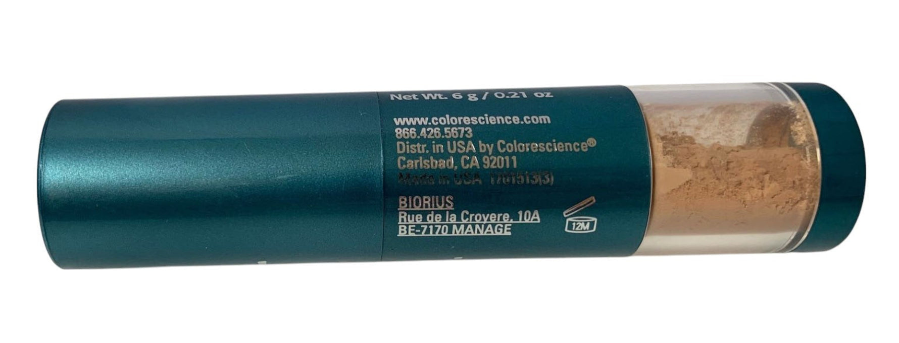 Tube of colorant powder with visible brand name on a white background