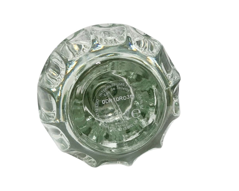 Clear glass ashtray with intricate design on a white background