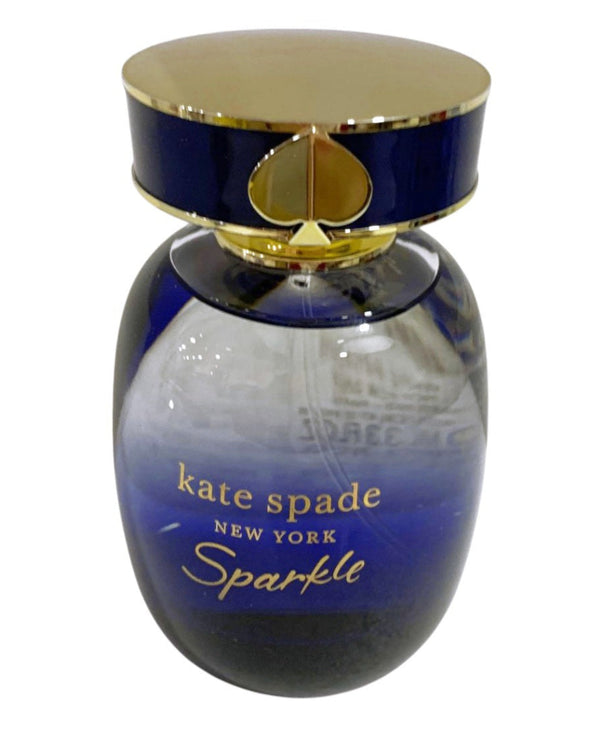Blue and gold perfume bottle with Kate Spade New York Sparkle text on a white background